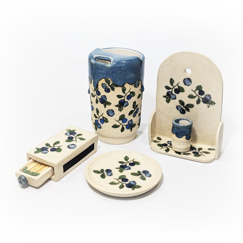 Blueberry themed ceramic matchbox, sippy cup, altar with tiny vase, and a trinket dish.