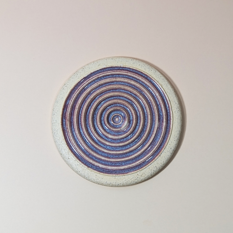 A top view showing the beautiful purple glaze break over the ridges.