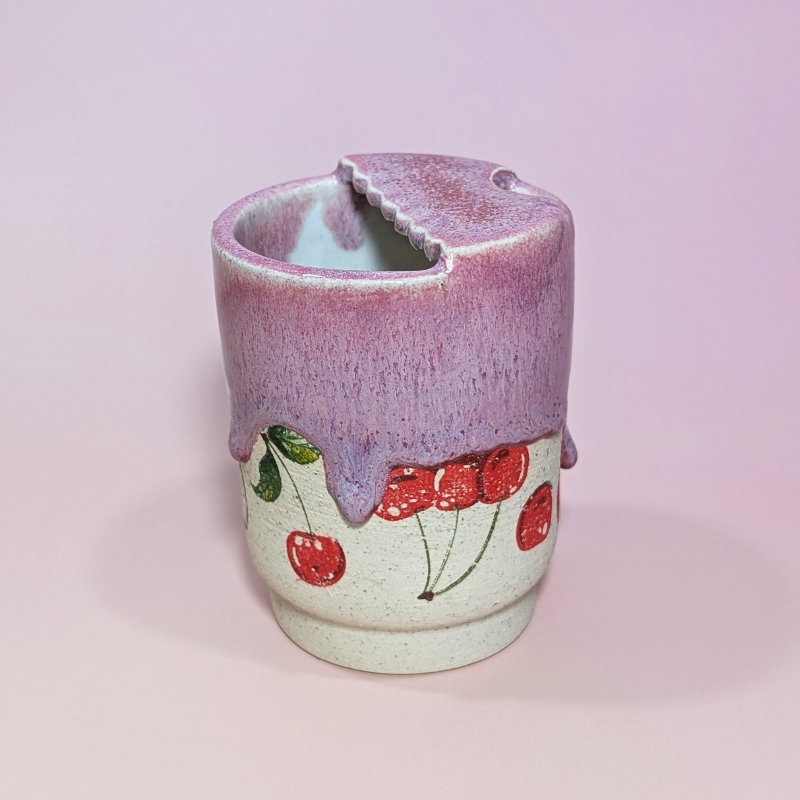 A side view showing the scalloped lid and more cherries!